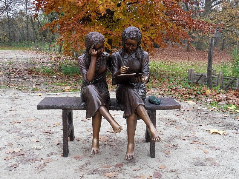 2 Girls Sitting On Bench