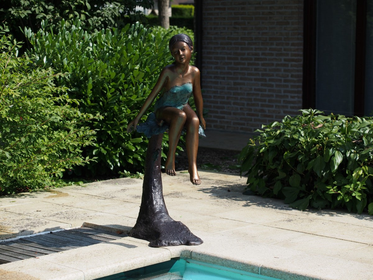 Girl Sitting on Log