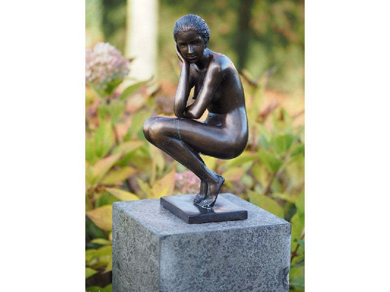 Squatting Woman