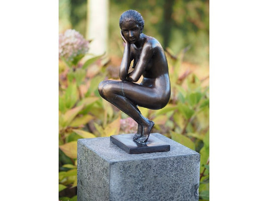 Squatting Woman