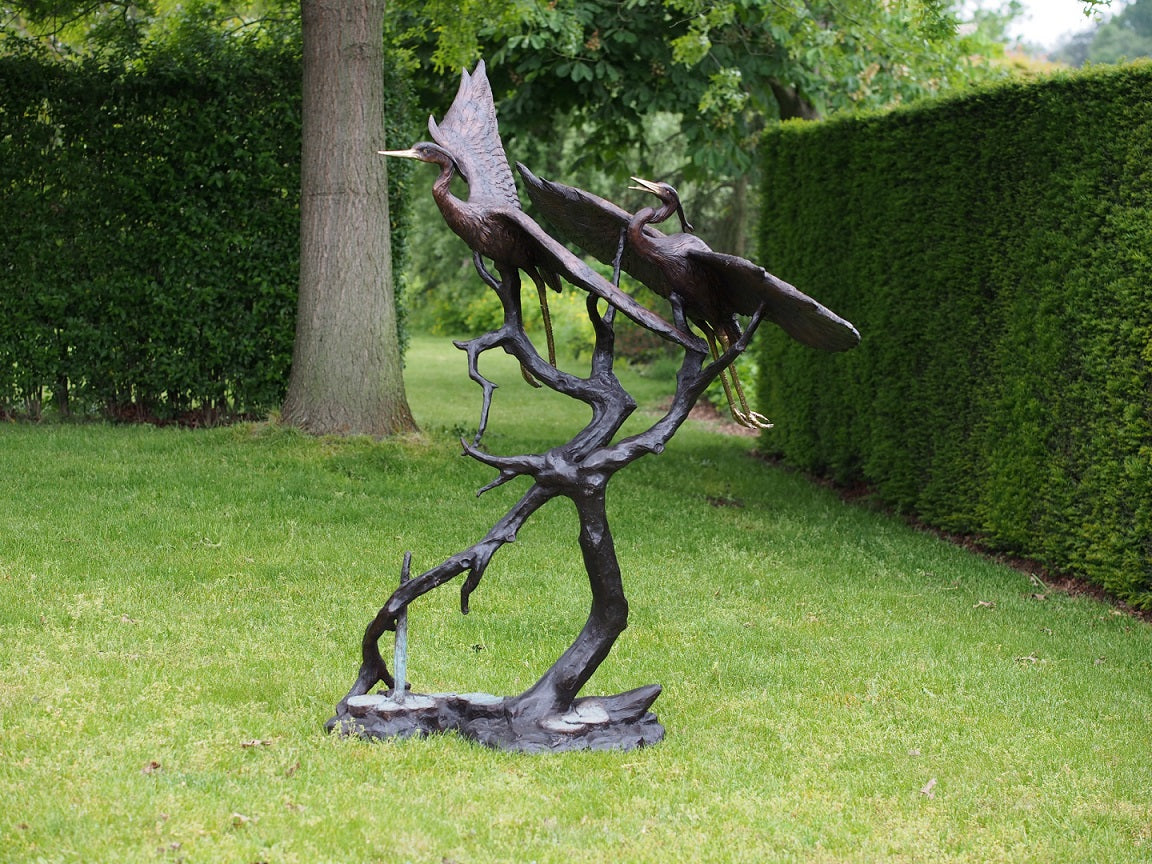 Crane birds on tree