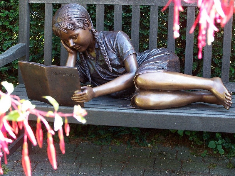 Laying And Reading Girl